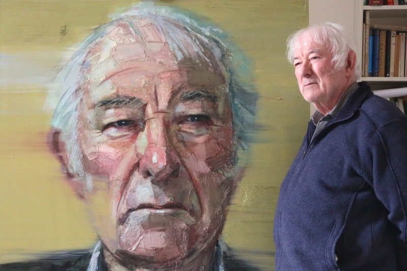 Seamus Heaney with his portrait
