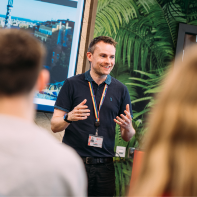 Male Student services staff member giving a speech