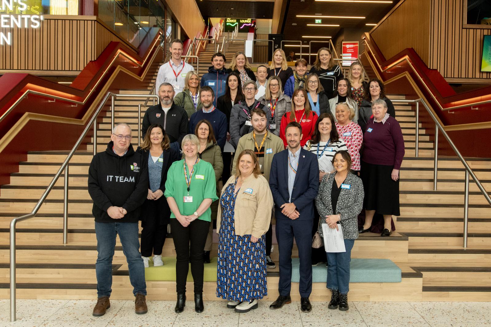 Image shows external partners of the Scheme, and staff from Queen's placement host departments.