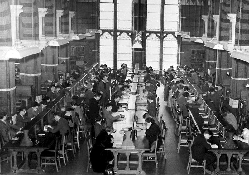 Overhead view of inside the old Queen's library with many students studying