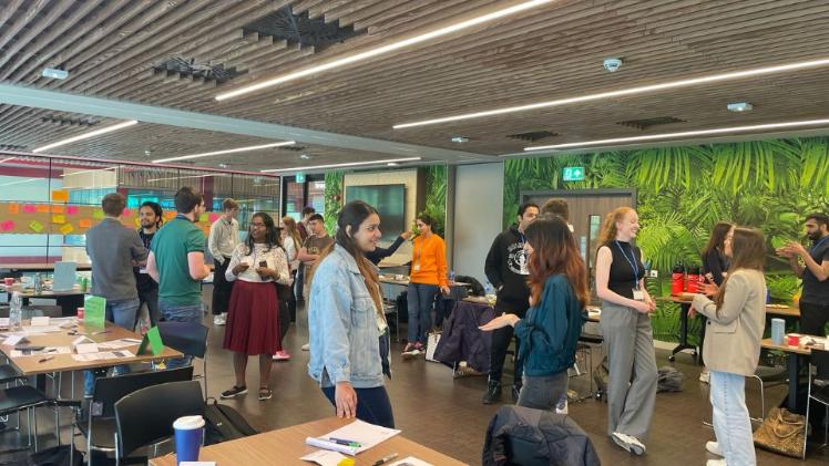 students at an event in the Cube in One Elmwood networking