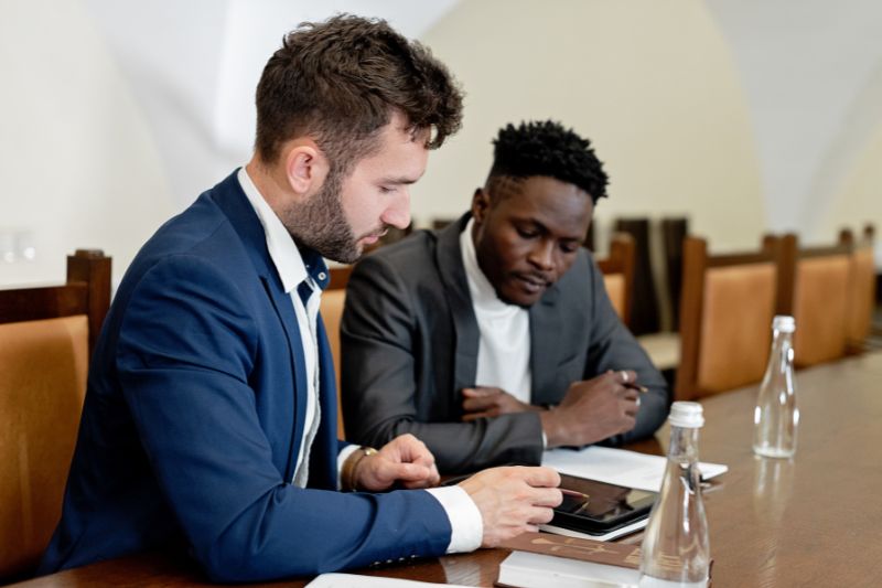 two males sitting in a meeting