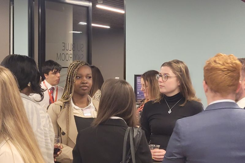 student networking in formal clothing