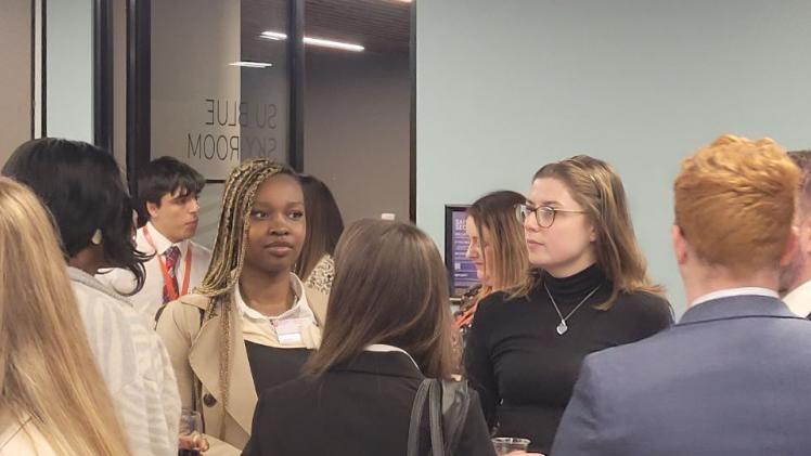 student networking in formal clothing