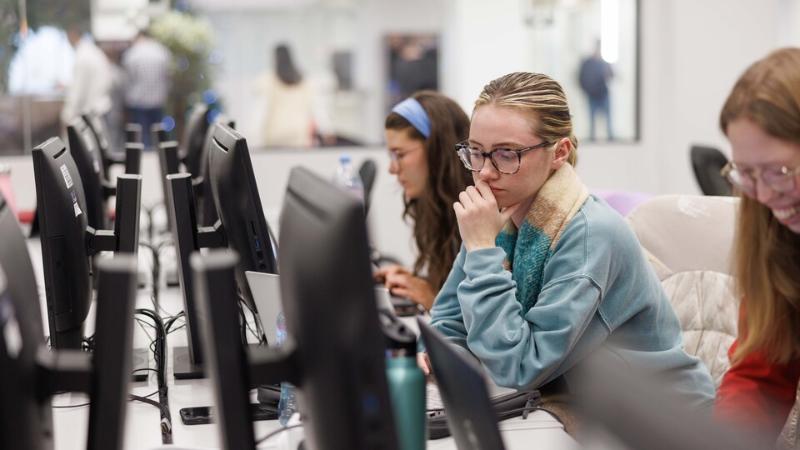 Students sitting in front of computers