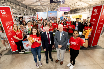 A member of the parasitology team and a PhD researcher pose with Dr Ryan Feeney and Professor Stuart Elborn at the Balmoral Show 2024