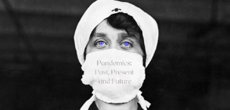 Nurse wearing a mask with the words 'Pandemics, past, present and future' on it