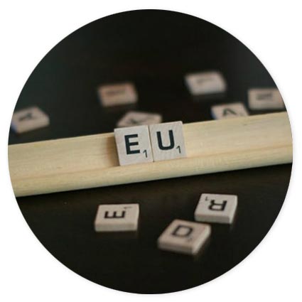 Scrabble tiles spelling out EU