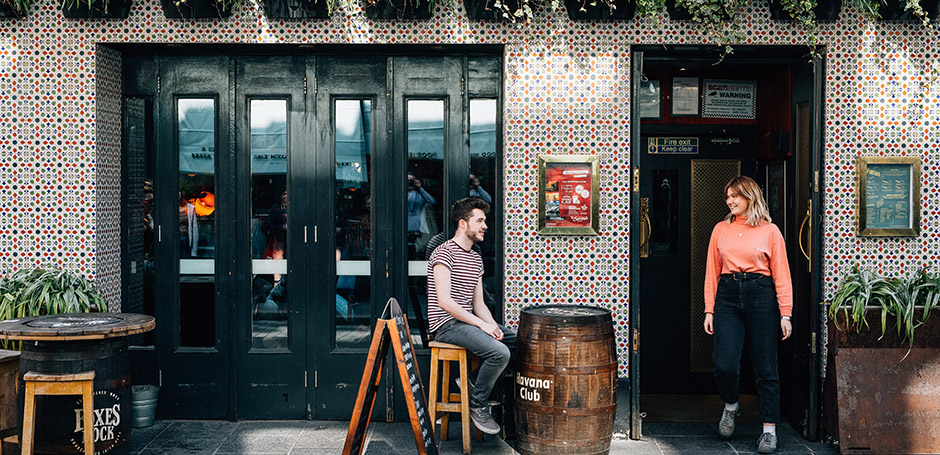 Two students meet outside a bar in Belfast