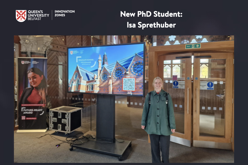 Photo of Isa Sprethuber, new PhD student, in the Graduate School at Queen's (a 19th Century building with vaulted ceiling and modern equipment)