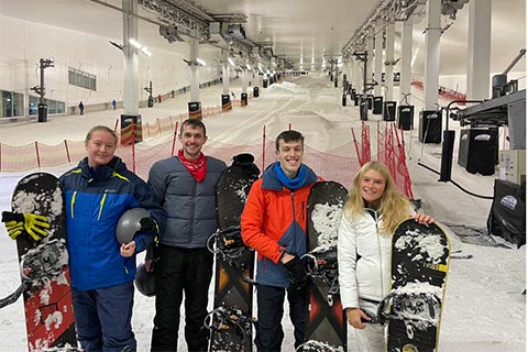 Student Charlotte and friends snowboarding