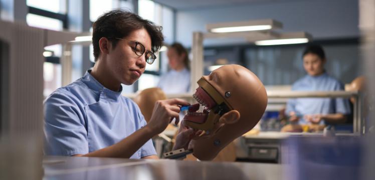 QUB dentistry student practising on phantom head