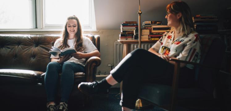 Two female students sitting in the School of English