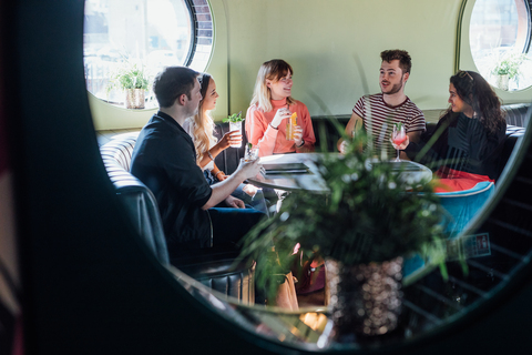 Group of friends drinking together in bar