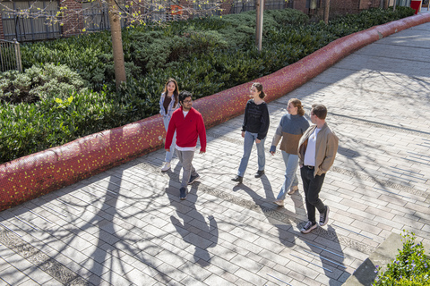 Group of friends walking around campus