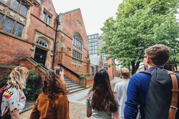 Group of students walking towards the Queen's Music Building