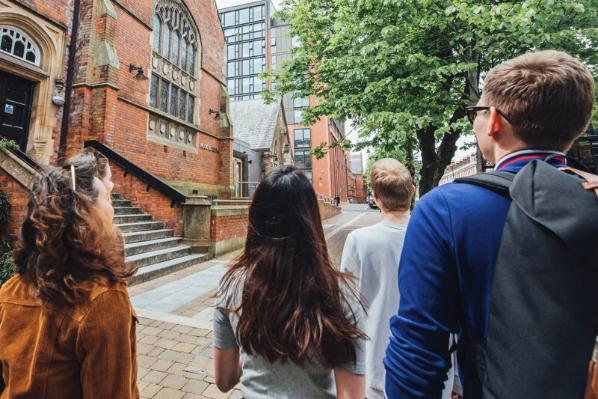 Group of students walking towards the Music Building