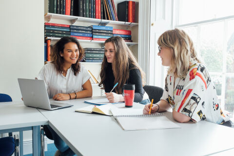 Three female students in group study