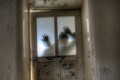 Shadow of person in haunted jail