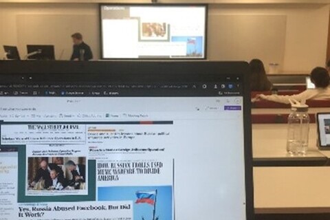 Laptop on table in lecture hall