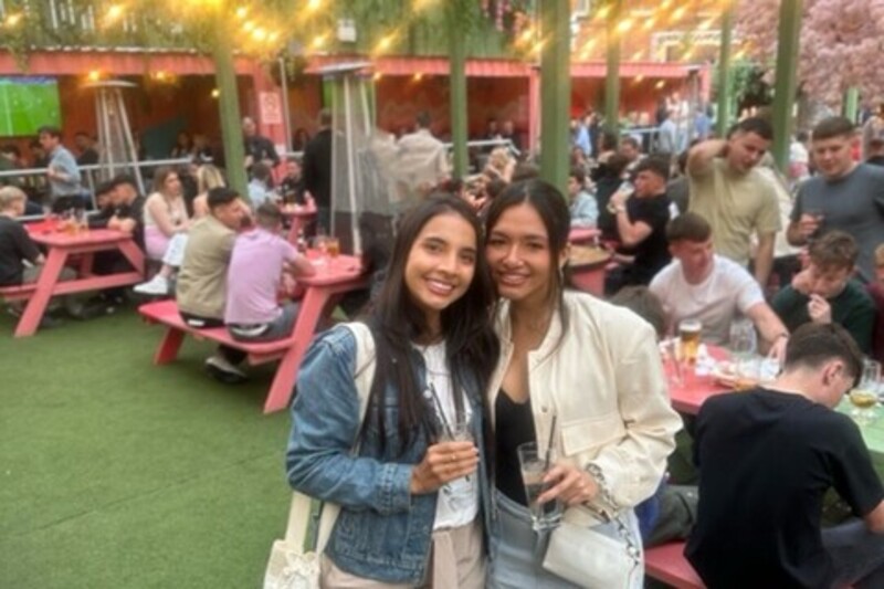 Two female South American students in The Boneyard, Belfast