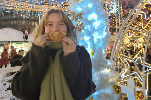 Female student standing in front of white Christmas tree in Toulouse market