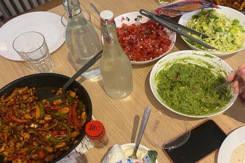 Bowls of fajita ingredients on table