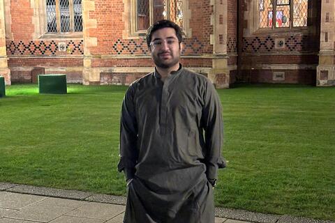 Student Muhammad standing outside the Lanyon