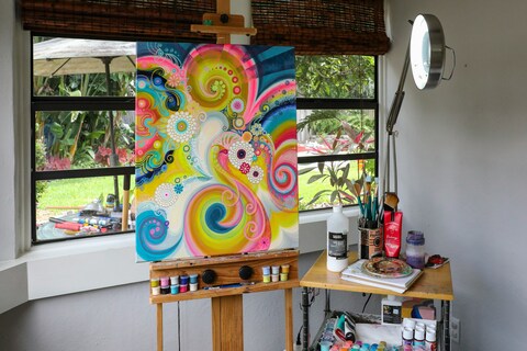 Colourful painting on canvas sitting on easel