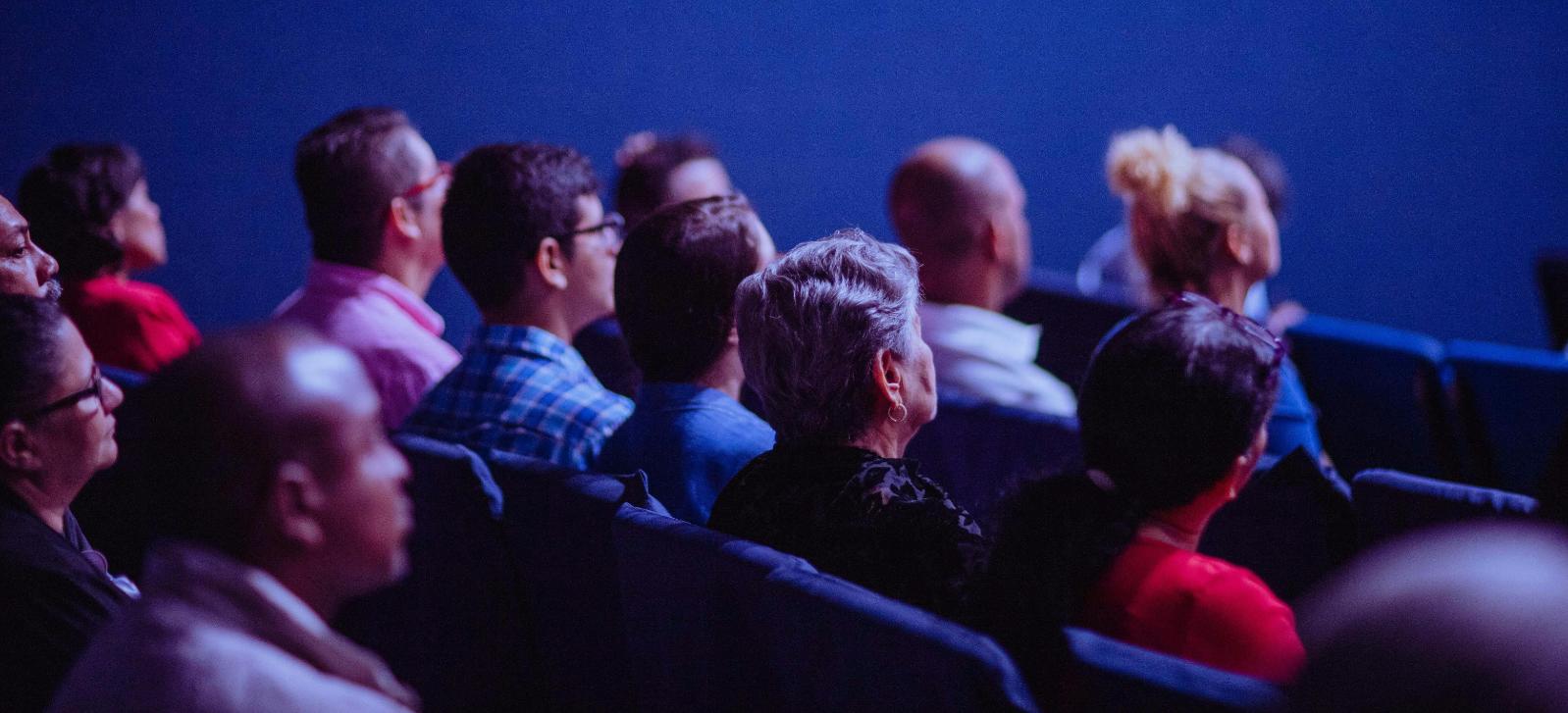 Group of people in a cinema screen