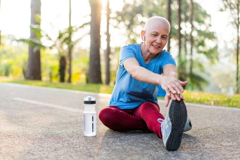 Person stretching on the ground before a run