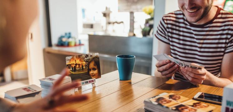 Two students playing a board game in Queen's accommodation