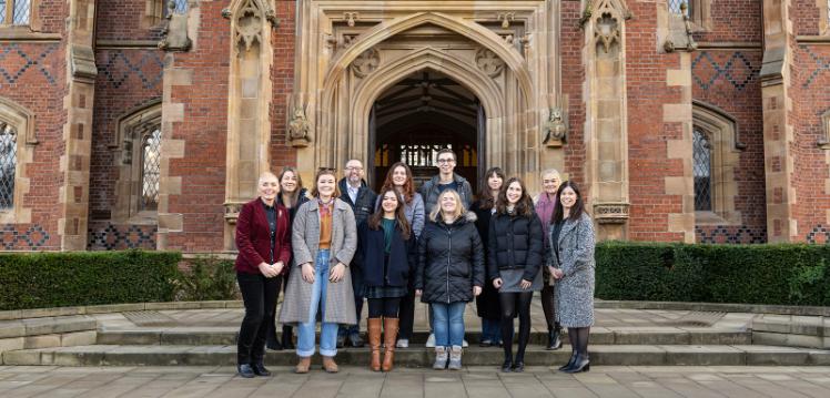 QUB North America international officers in front of Lanyon building