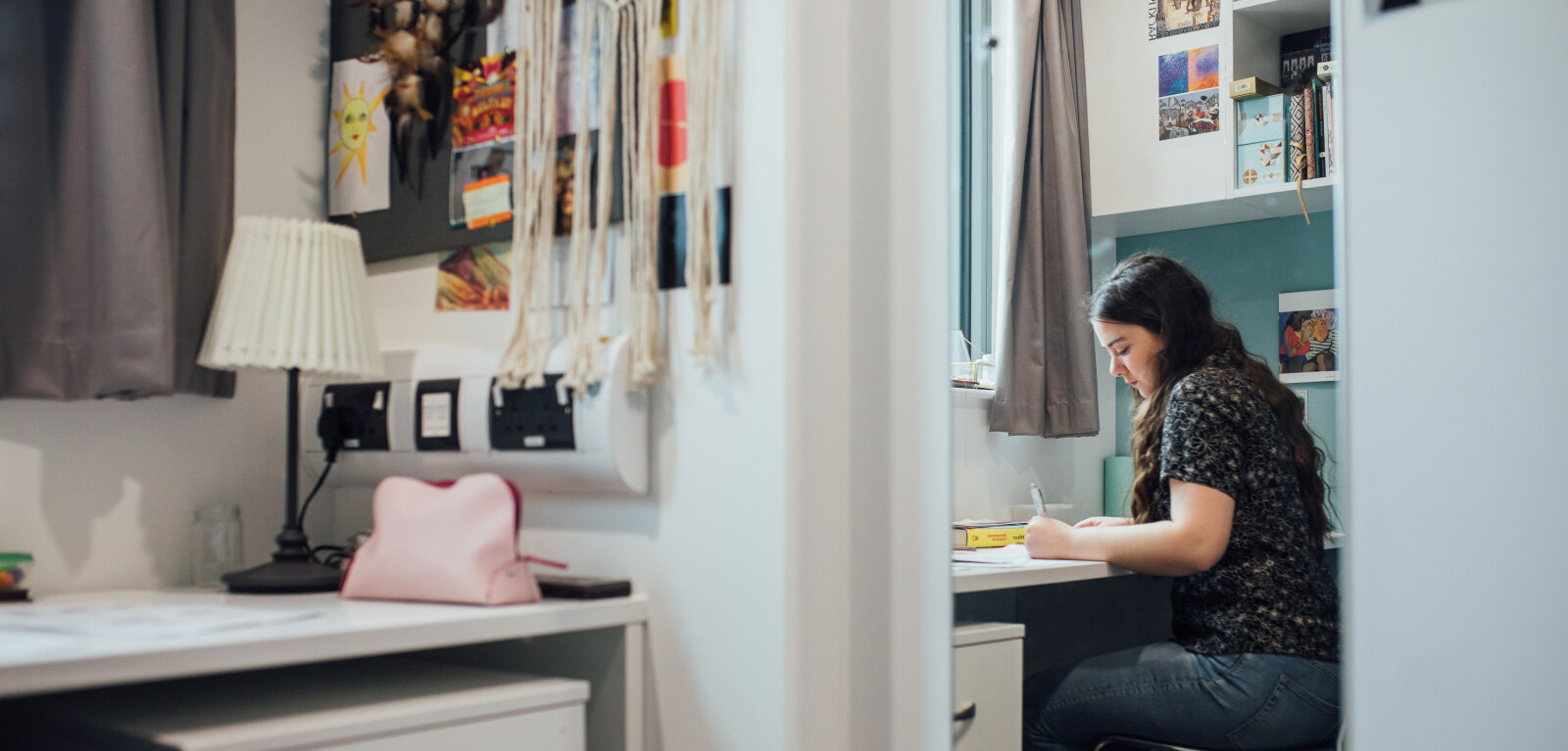 Student working at desk in accommodation