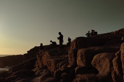 Students mountaineering in the evening