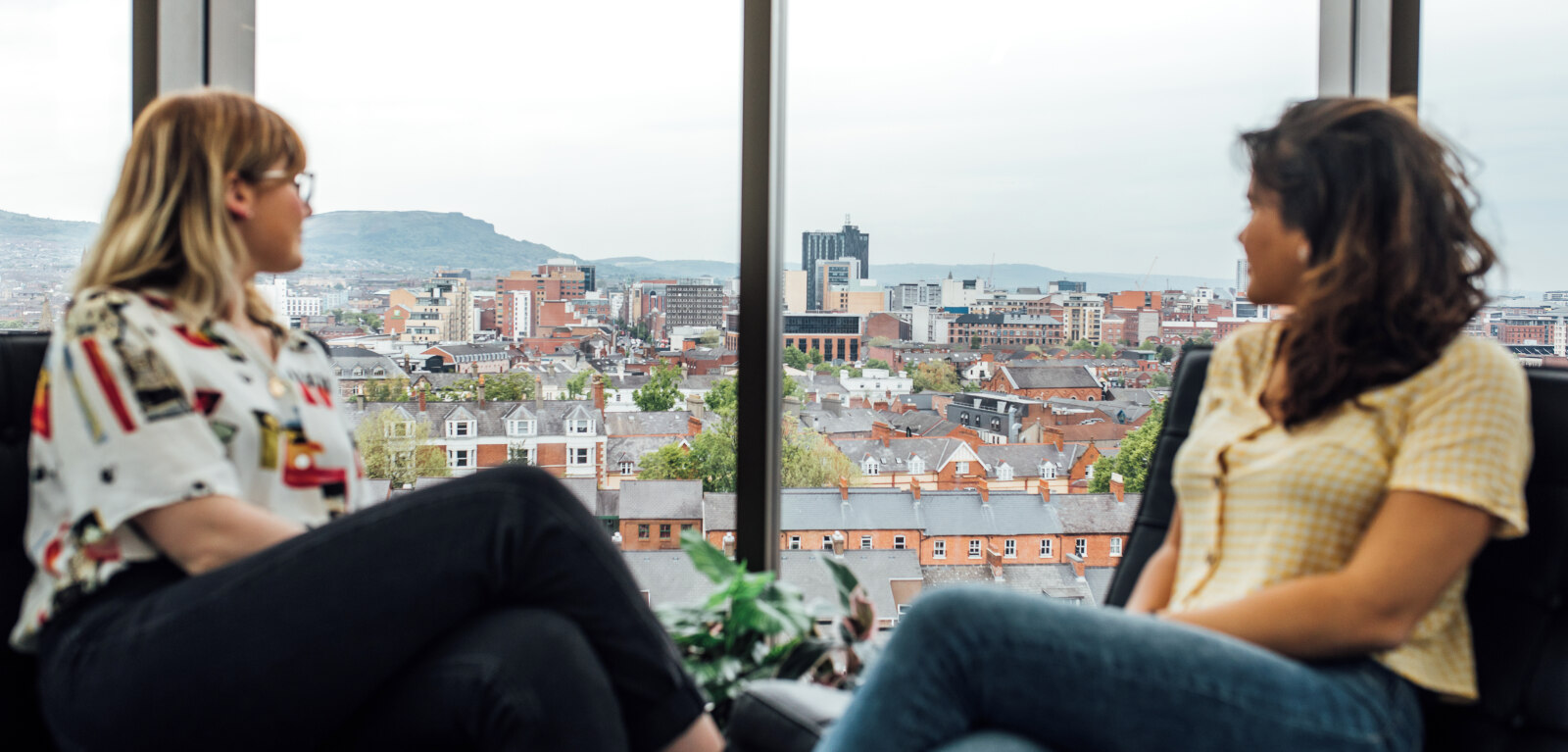 Two students looking out window