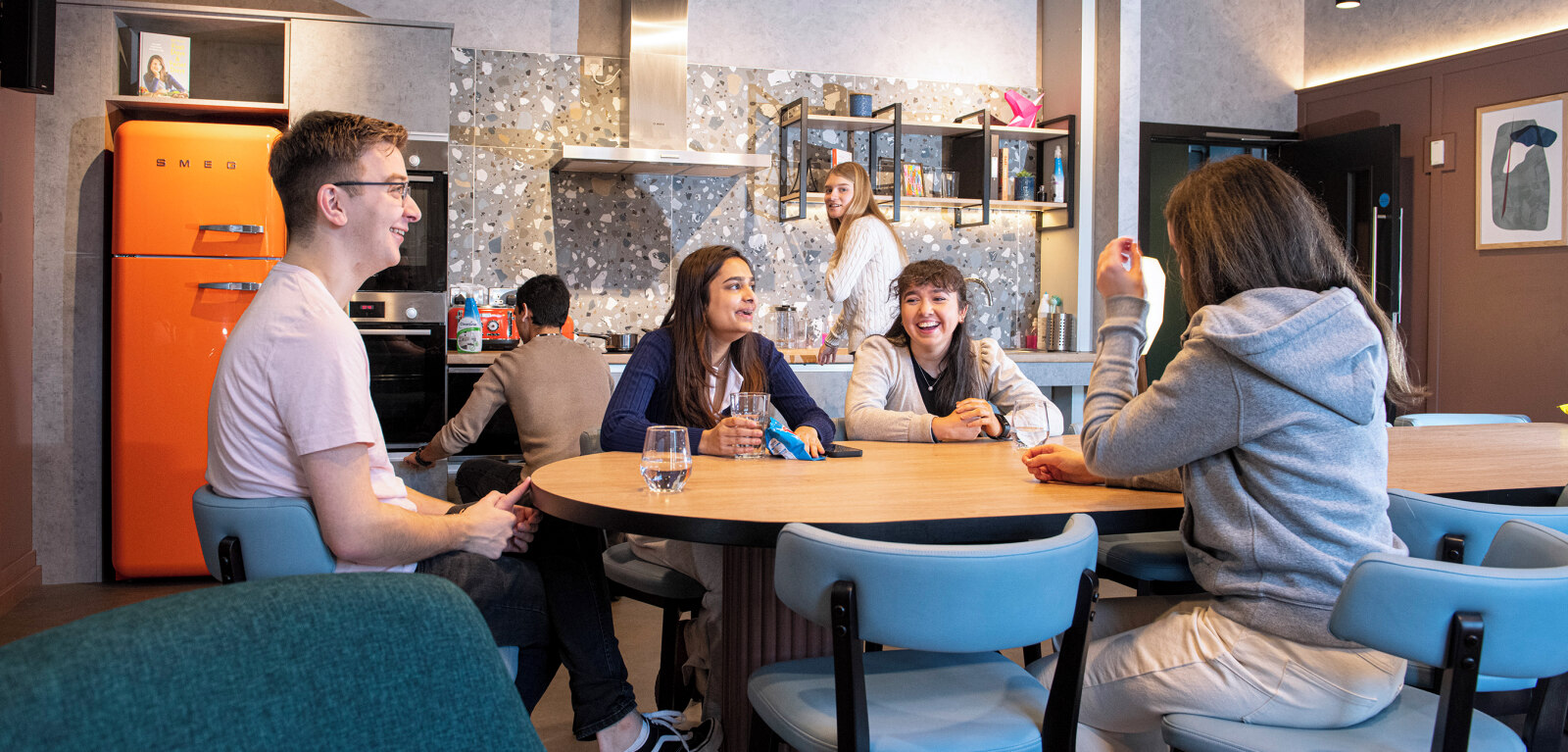 Students sitting together at table in the Treehouse