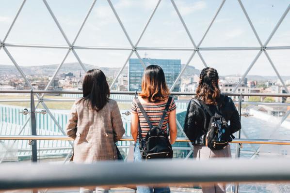 Three students standing at the top of Victoria Square