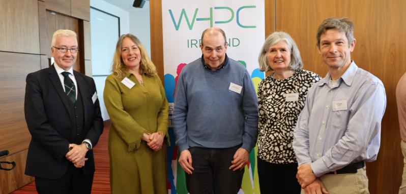 A group of computing experts stand in front of a banner which reads 'Women in High Performance Computing Ireland'