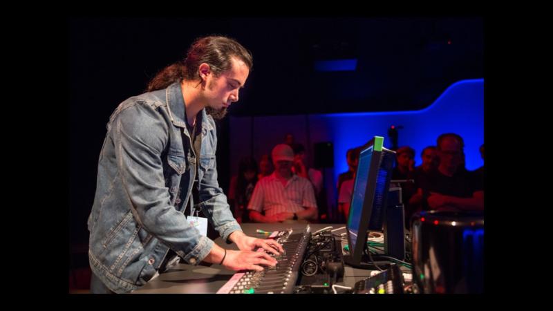 A person operating a sound desk