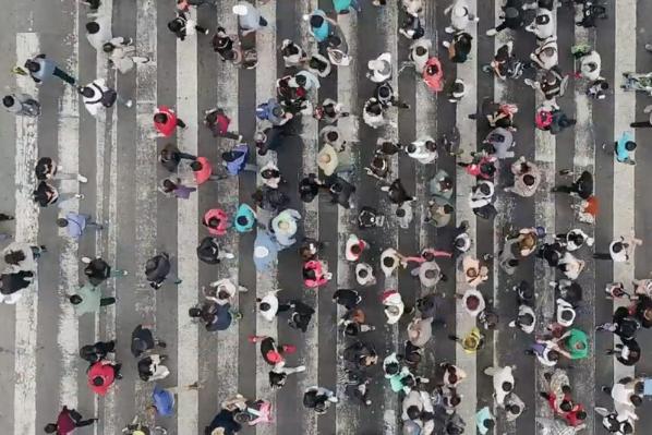 People walking along cross walk