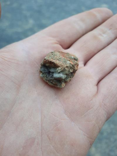 Hand holding a piece of clay