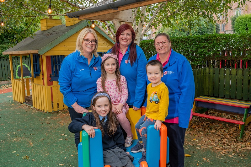 Pictured with Sarah, Katie and Patrick outside of Queen’s Childcare are (L-R) Karen McCormick, Head of Childcare at Queen’s, Bronagh Black, Childcare Assistant and Michelle Cardy, Childcare Assistant