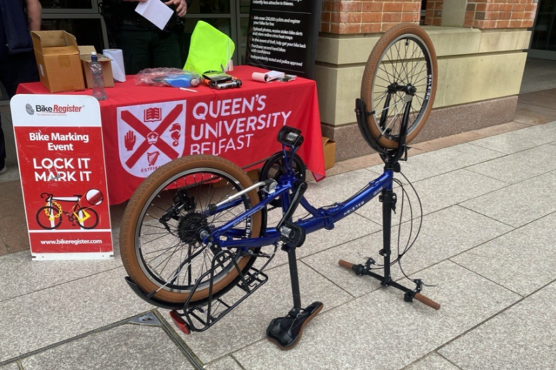 an upturned bike at a bike marking event stall, ready to be security marked - Queen's University Belfast